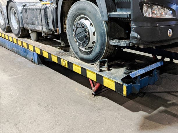 Heavy commercial vehicle positioned for workshop assessment