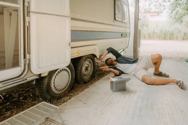 Roadside inspection beside a camper vehicle